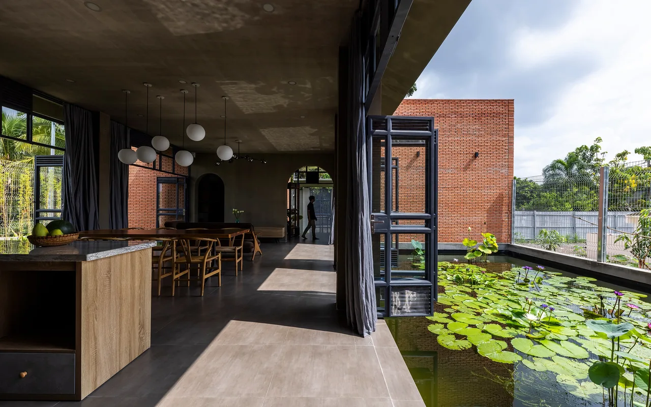 nha gach phong khach nha bep Nam House hien dai nhiet doi CTA | Creative Architects